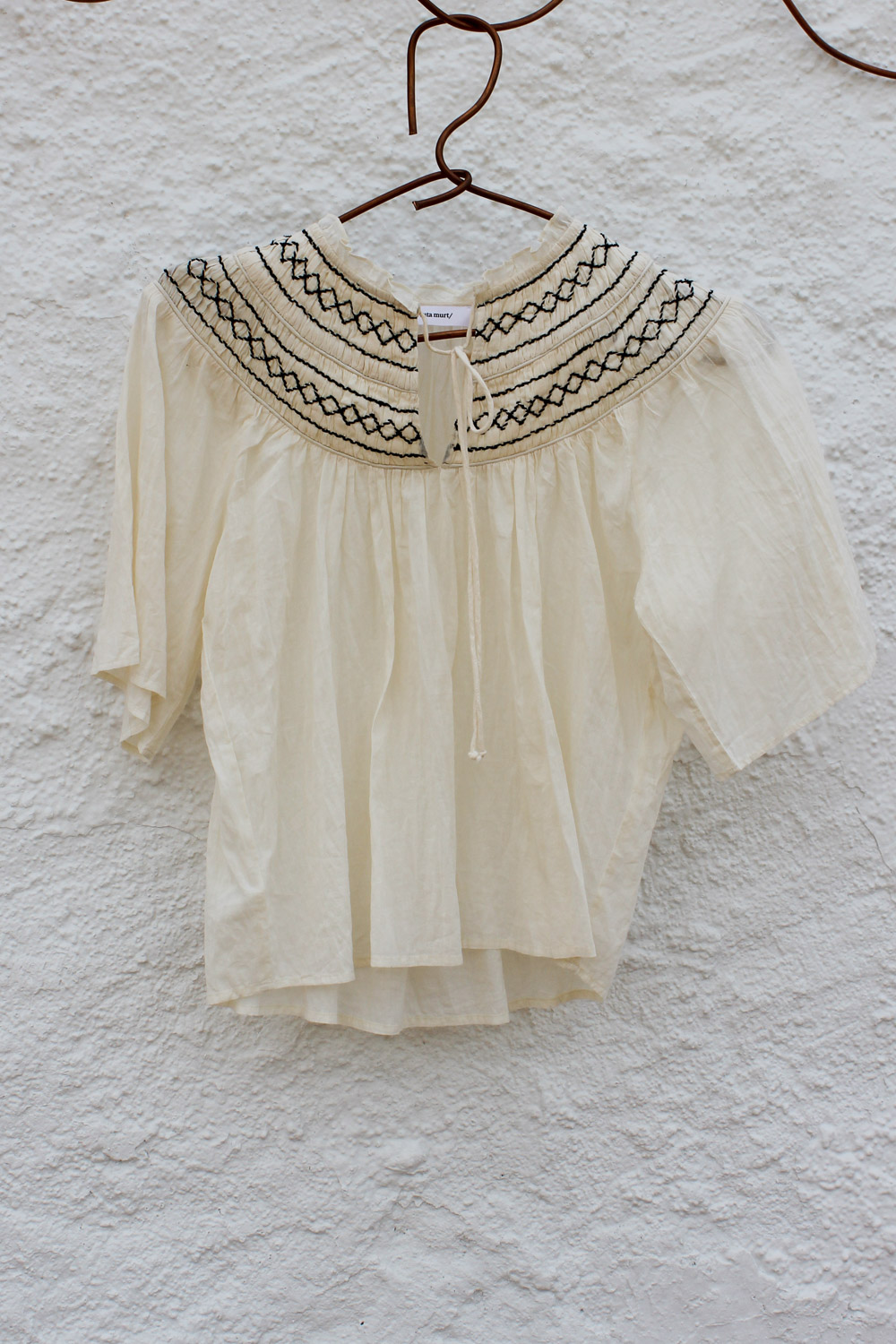 Blusa efecto arrugado.